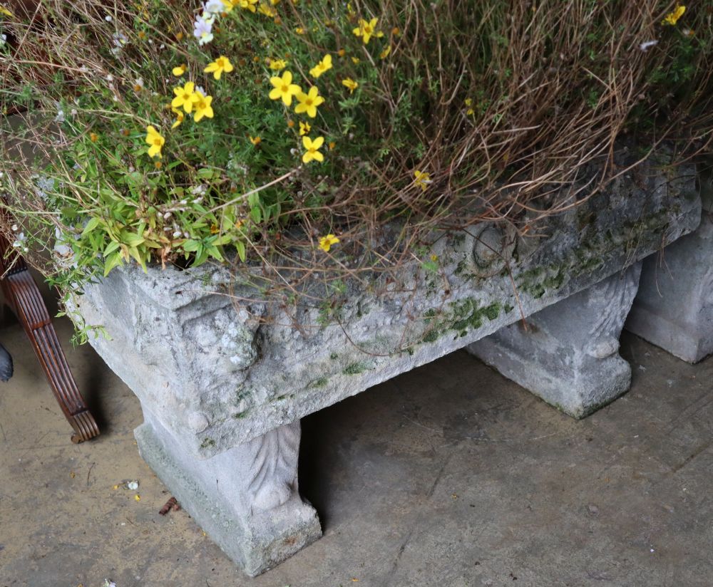 A reconstituted stone rectangular garden planter on trestle stand, length 92cm height 58cm